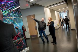 Heather with artist Rory Wakemup at the ribbon cutting ceremony for the Hagfors Center for Science, Business, and Religion.